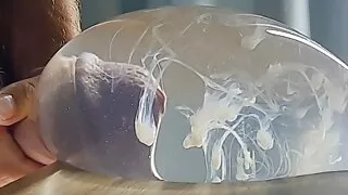 Slim guy TimonRDD cums hard in a water-filled condom