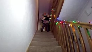 Maid cleaning the stairs in stockings