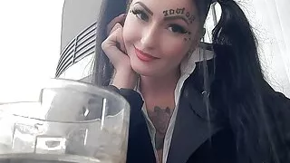 Smoking fetish. Dominatrix Nika smokes sexy and spits into a glass. Imagine that this glass is your mouth.