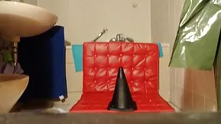 perv latex bessy is  riding giant dildo in her toilet room