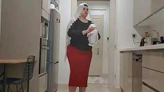 My stepson is observing me in the kitchen.