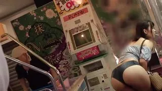 A woman with a big ass and no pants who exposes her plump, perky ass