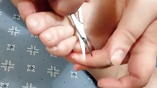 Ellie cuts her nails and then varnishes them