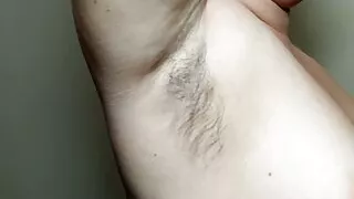 Ellie shows her hairy armpits and plays with them