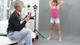 Redhead slut gets all wet at the sexy photographer and is eager to get fucked through