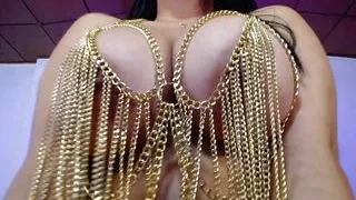 Sexy goddess plays with her big tits in chains outfit fuck big tits and sucks her nipples with a lot of pleasure