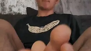 Giving you a footjob and a blowjob