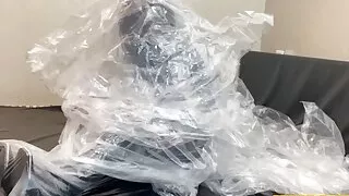 Fejira com Multi-layered plastic film-bound leather-clad girl