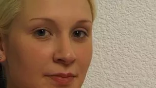 young girl lies down and plays with her firm breasts