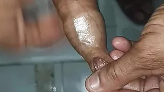 Indian middle age man massage his pennis with oil and gel