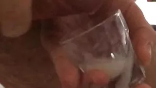 Huge messy cumshot in a shot glass