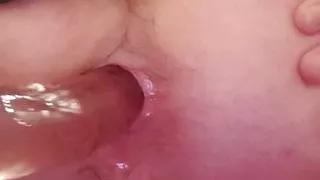 Sissy in a skirt uses dildo on juicey hole