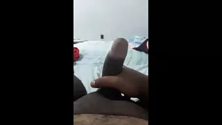 Hot black man with dick throbbing to come, lying on the bed just showing his dick and stroking hard and the head