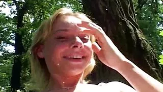 Sweet German teen pleasing her tight pussy in the woods