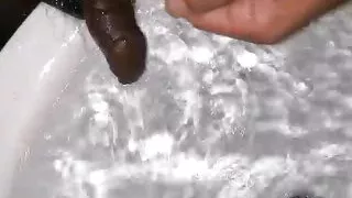 Washing his small black cock pee teen young sexy boy