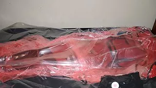 Mar 2 2023 - VacPacked in my long red raincoat under my PVC aprons and pink PVC sack
