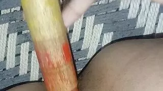 Hot girl having sex using stick to cool down her pussy fire