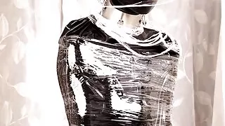 Fejira com Full body wrapped in tight latex clothing and plastic wrap