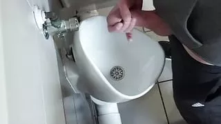 Wank at public toilet