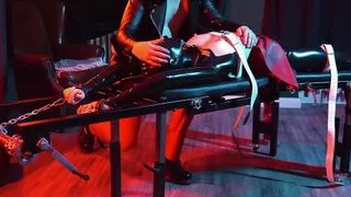 heavy rubber masked latexgirl stretched and tickled