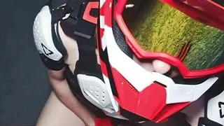Naked boy in motocross gear and mxhelmet gets a strong orgasm