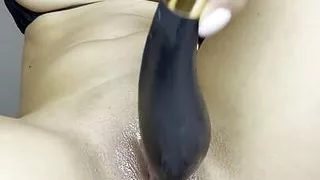 Pounding my pussy with a big black dildo