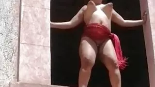 Devska plays at the ranch's window for the whole world to see