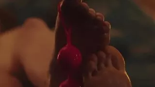 Footjob from a young bitch with balls in her fingers