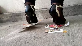 Girl trampling stomping on picture in metal high heels