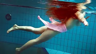 Simonna is hot and horny in the public swimming pool