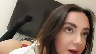 Using a vibrator with her tits exposed