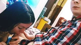 Hot babe is sucking boyfriend's dick while he's playing video games