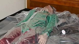 Dec 25 2022 - Christmas Day VacPacking in my red PVC pants green satin shirt & tie with PVC aprons