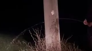 Demon having a long piss out in the open