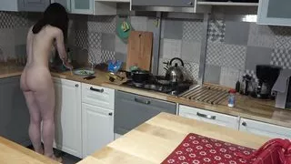 Stunning brunnette makes breaskfast in the kitchen