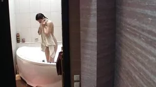 Stunning brunette getting of the shower naked