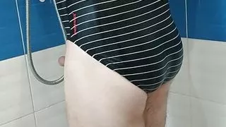 Boy wearing Speedo swimsuit and jerking