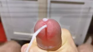 Cumming in close-up with a massive portion of cum in slow motion. Big Uncut Veiny Cock. Pissing