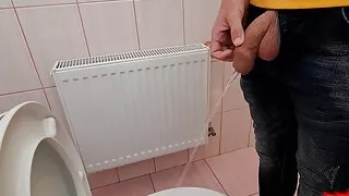 Guy pisses in a public toilet and takes a selfie
