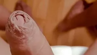 trans Erika Schinaider touching herself at home