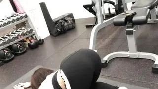 A cute woman masturbates when her body is hot after exercising at the gym.