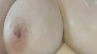 Natural Big Tits getting soapy in the bath