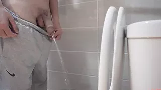 The guy took off his pants and pees