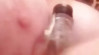 Bottle between the tits