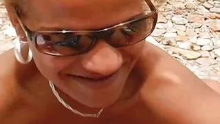 A horny German ebony sucking a hard cock on the beach