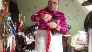 In a small white skirt chained