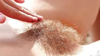 Sexy model Audrey strips down showing off her hairy pussy