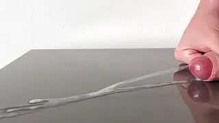 Huge cumshot on reflecting table after days of edging