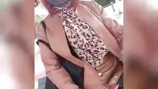 sissy in bourgeois chic and slutty on the station platform