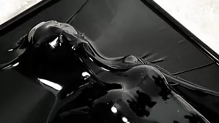 Fejira com Orgasm in a more wrapped latex sleeping bag